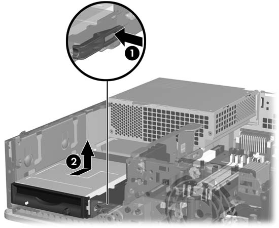 3. Tryck på enhetens gröna låshake på höger sida om enheten (1) så att enheten lösgöres från enhetsinfästningen.