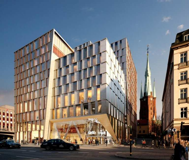 FÖRÄNDRINGAR - GESTALTNINGSPRINCIPER 6 (31) Dp 2010-18583-54 Illustration av den nya bebyggelsen mot Vasagatan med stationsingången. Till höger syns Klara Vattugränd med Klara kyrka i fonden.