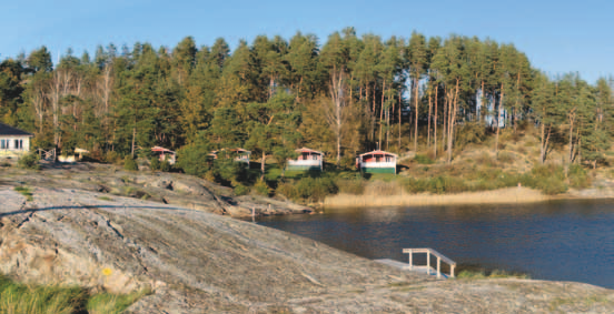 Illustration 12. Fotomontage F18 från badplatsen vid Ulvön, cirka 1,5 kilometer väster om Ljungskile. Avståndet till närmaste planerade vindkraftverk är 5,9 kilometer.