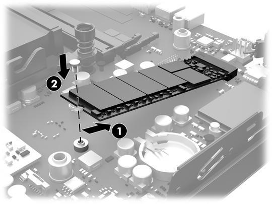 15. Ta tag i SSD-enheten på sidorna och dra försiktigt (2) ut den ur sockeln. 16. Sätt i den nya SSD-enheten i sockeln på moderkortet. OBS! En SSD-enhet kan enbart installeras på ett sätt. 17.