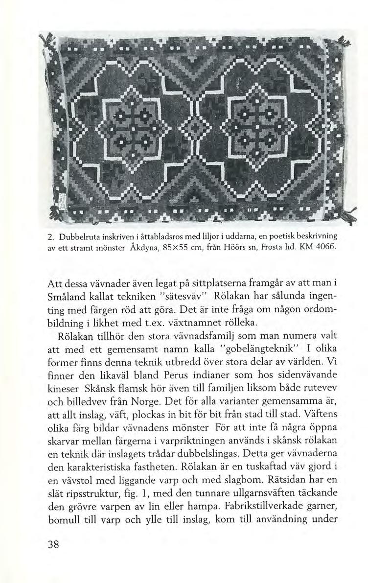 2. Dubbelruta inskriven i åttabladsros med liljor i uddarna, en poetisk beskrivning av ett stramt mönster Åkdyna, 85 X 55 cm, från Höörs sn, Frosta hd. KM 4066.