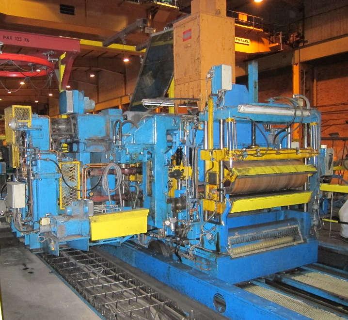 Slingbord 2, monterat på bromsvagnen, har två separator-rullar och en permanentmagnet. Separatorrullarna är monterade på en vagn som underlättar bytet när skärprogrammet ändras.