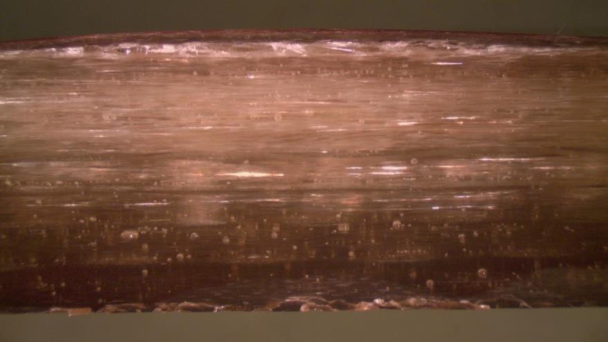 Barrier layer Figur 30 Polerat tvärsnitt av laminat IV-A. Delamineringen ligger tydligt under ytmattan i den första CSMmattan Figure 30 Polished cross-section of laminate IV-A.