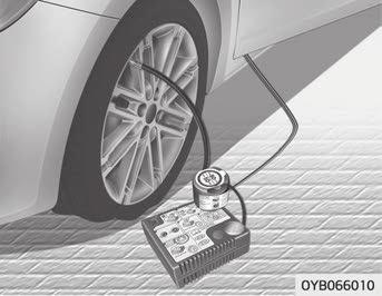 Ta loss hastighetsbegränsningsetiketten (1) från tätningsmedlets behållare (2) och sätt den på en väl synlig plats i bilen som till exempel på ratten för att påminna föraren om att