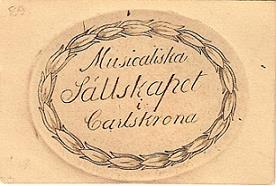 Inträdeskort till Medlemskort, baksidan, den årliga Högtidsdagen som tillhört Fru Öfverstinnan 1:a december Nordenschöld.