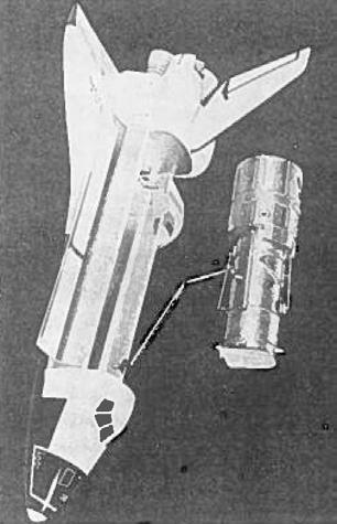 Fig. 7a. Hubble Space Telescope lyfts ur rymdfärjan. Fig. 7b. Hubble Space Telescope i genomskärning. Huvudspegeln med 2,4 m diameter syns något till höger om mitten.