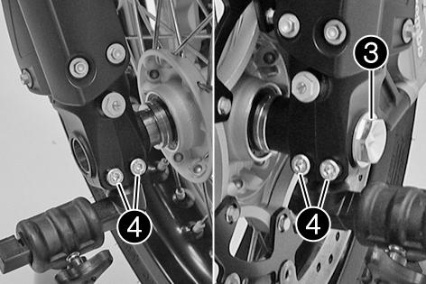 HJUL, DÄCK 87 12.1Demontera framhjuletx Lyft upp motorcykeln med lyftanordningen baktill. ( s 62) Lyft upp motorcykeln med lyftanordningen framtill. ( s 61) Ta bort skruvarna och distanshylsorna.