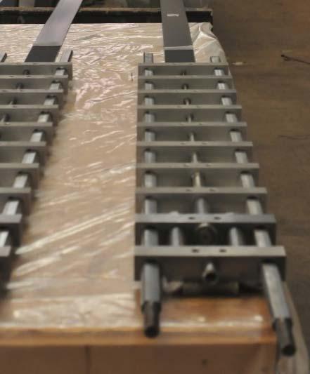 Small molded nuts (2 screws/tab) are glued into the holes in GFRP GFRP with the molded nuts are glued at each end of the CFRP laminate, see Figs. 2.4 and 4.