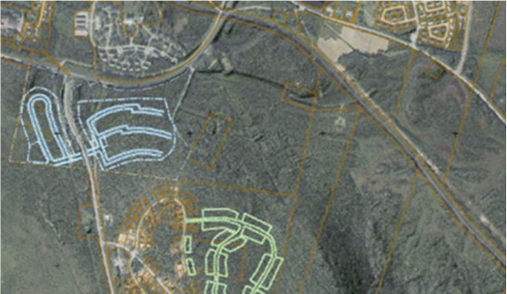 Figur 5: Översiktsbild av planområdets läge, markerad med röd ring, befintliga detaljplaneområden, Norra (blått), Mitt (grönt) och Repisvaara södra (gult och rosa).