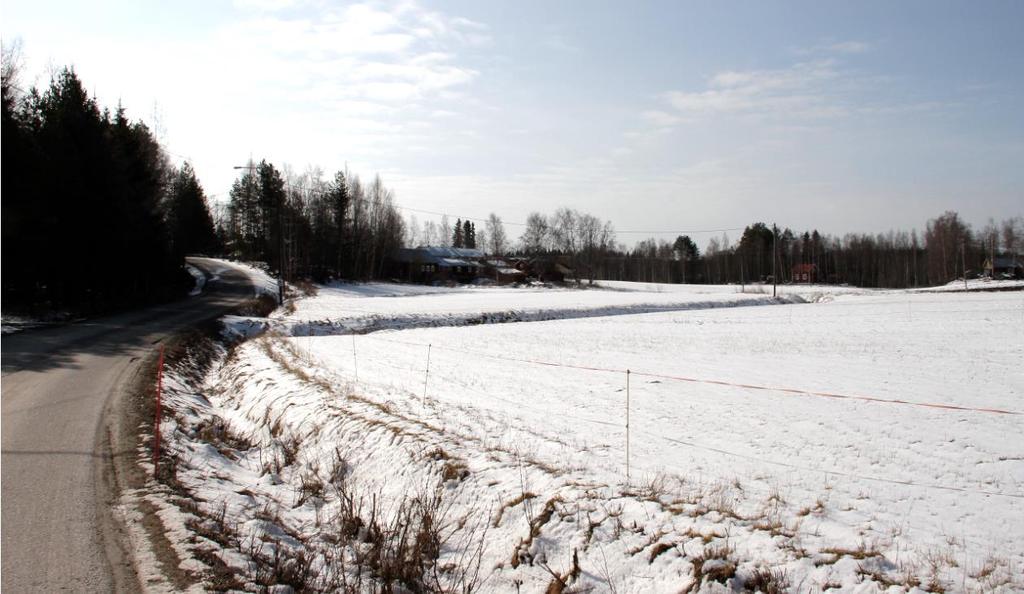FCG SUUNNITTELU JA TEKNIIKKA OY Rapport 10 (20) Bild 7. Finnäs by sett från den norra sidan av den öppna åkern.