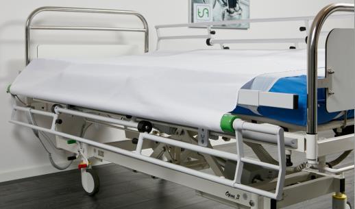 TurnAid T2/T3 ställs i arbetsposition (bild 5.2) genom att lossa de två blå låsspakarna och vrida den översta delen så att rullen med lakanen hamnar längst upp.