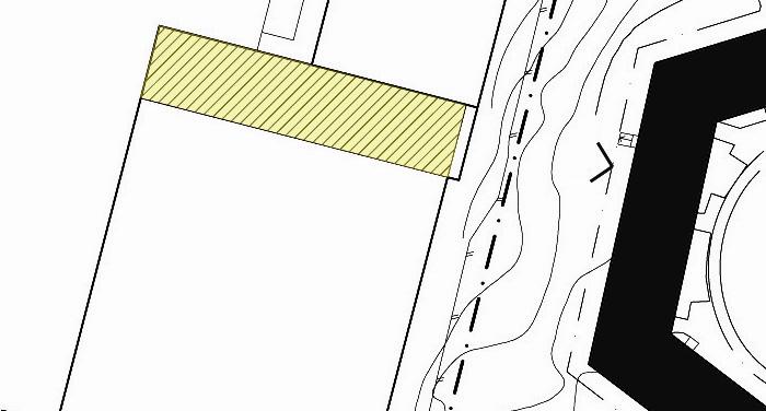 Påbyggnad sedd stående på marknivån utanför bostadshusen på