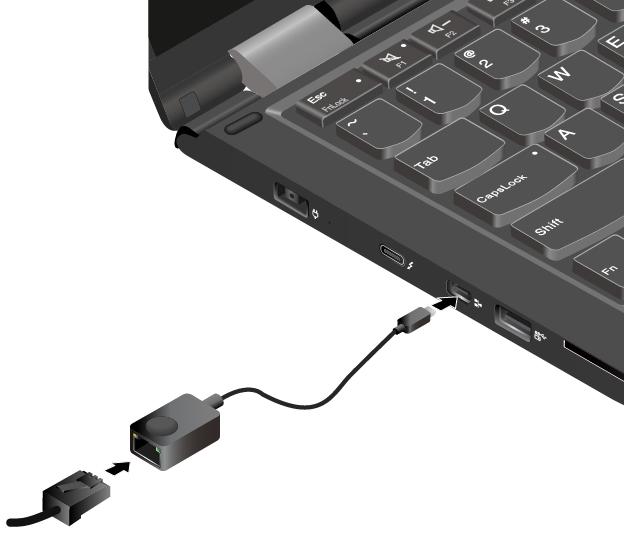 2. Anslut ena änden av Ethernet-förlängningsadaptern till mini-ethernet-porten på datorn. Anslut sedan den andra änden till en Ethernet-kabel.