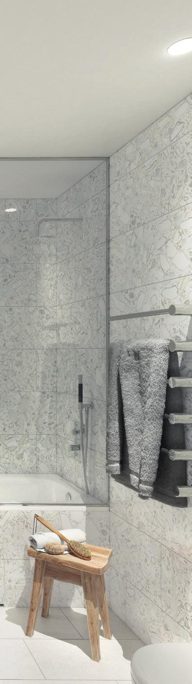 BADNATUR I bad- och wc / dusch-rummen kläs väggarna i ljus terrazzo ett klassiskt, hållbart material som har fått ett välförtjänt