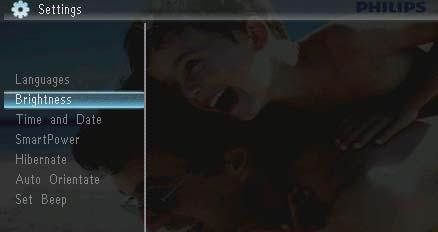1 Välj [Settings] och tryck sedan på. 2 Välj [Brightness] och tryck sedan på.