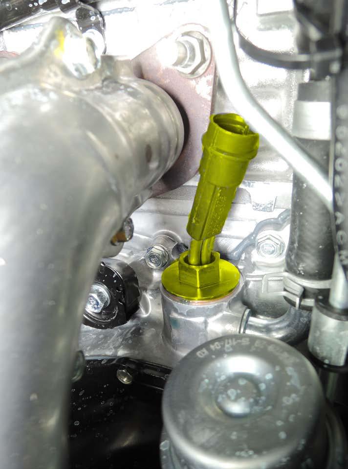 Remove intake hose (A) from plastic housing. Remove screws (B) x2 from turbocharger housing, loosen hose clamp (C) and turn the plastic housing forward. 2. Remove the plug (D). 3.
