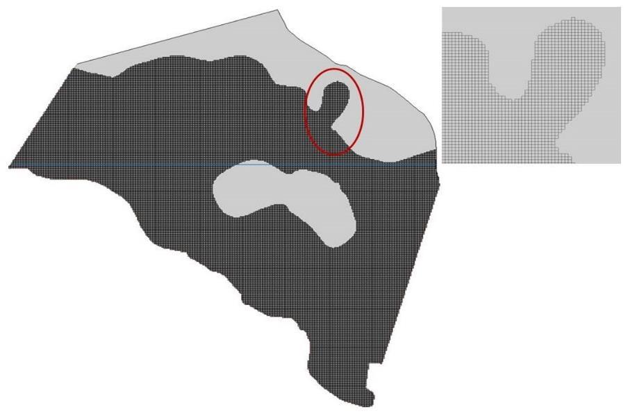 Figur 23 Framtagen numerisk modell samt rutnät i MODFLOW. Topografin i området är som nämnt varierande då berg i dagen är frekvent förekommande.
