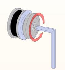 Sätt nu en nyckel e.dyl i hålet på sidan av hjulet och vrid (2).