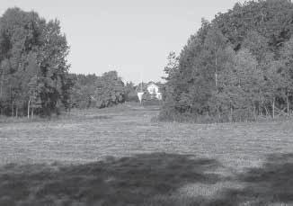 Fig. 9. Småbrutet odlingslandskap vid Sälten. Fotot (mot nordväst) är taget från den gamla landsvägen. Foto: P. Connelid.