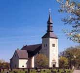 En liten meditativ byggd i äldre stil med spånplattor på fasaden. Framtagna målningar i koret.