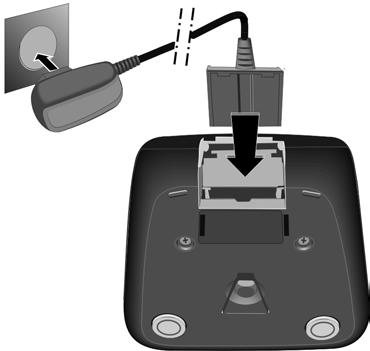 B > Placera handenheten i laddaren och vänta tills batterierna är fulladdade (ca tio timmar).