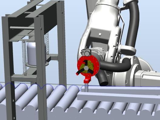Figur 30: Robotens verktyg placerar brickan