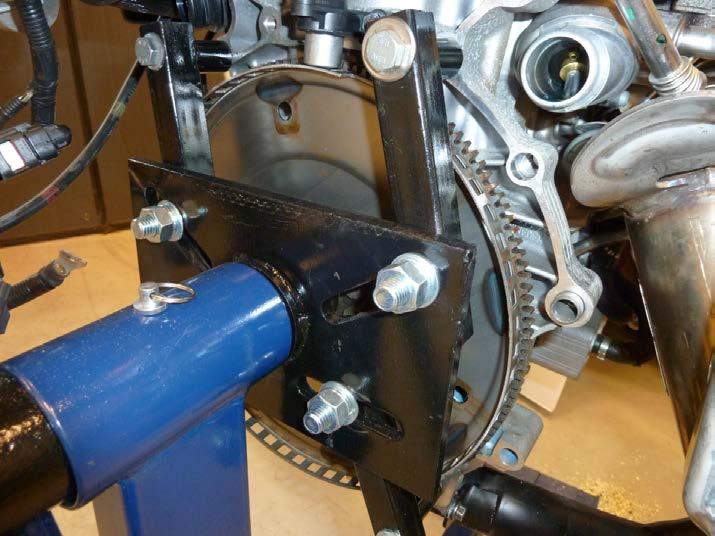 1.3. Scope 11 Hall effect sensor Flywheel Punched holes Figure 1.5: A picture of a flywheel and the Hall effect sensor.
