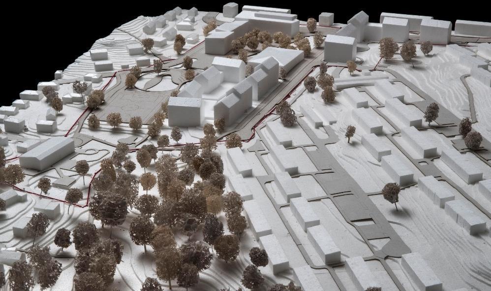 Sida 8 (16) Vy från väster på granskningsförslaget med Laxholmens radhus till höger och bollplanen till vänster i modellbild.