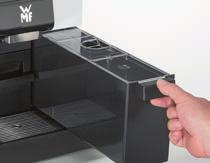 Uppsamlingsvannan finns under kaffesumplådan. Rengöra uppsamlingsvannan om den är smutsig.
