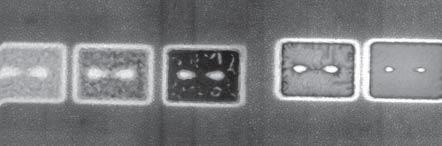 Experimental toolbox a) 1 m b) 500 nm Figure 2.15: SEM images of the effects of an adhesion layer on a sapphire substrate. a) Milled structures in gold with a Ni adhesion layer.