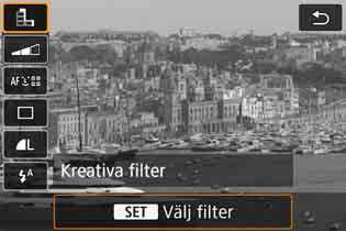 v Fotografera med kreativa filtereffekter Med metoden <v> (Kreativa filter) kan du använda något av tio filtereffekter (Grynig svartvit*, Mjuk fokus*, Fisheye-effekt*, Akvarell*, Leksakskamera*,