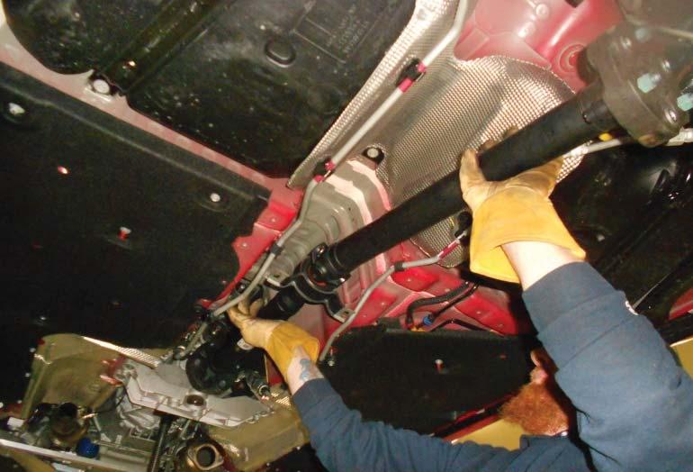 18. Compressthedriveshafttoclearthetransmission