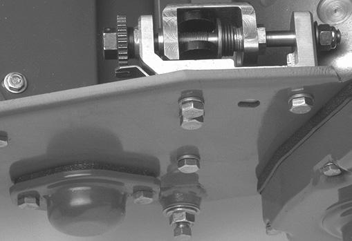 On Greensmaster 600 only, install the new height of cut arms and roller assembly with the height of cut adjusting screws, jam nuts and set screws previously removed (Fig. ).