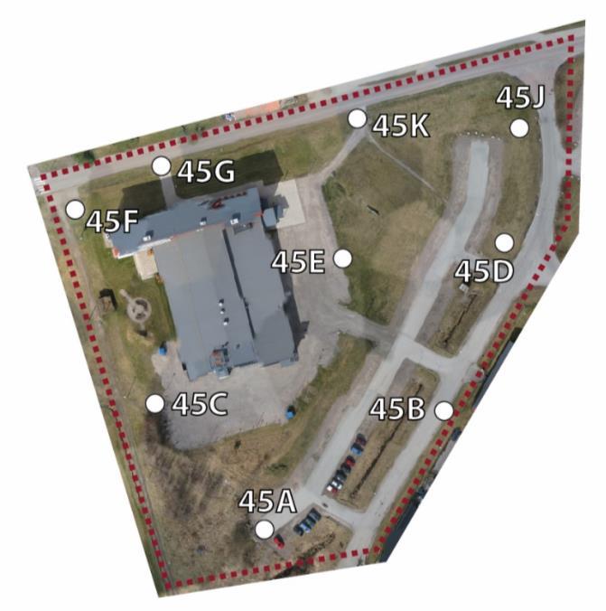Figure 4. Illustration of the area of interest (red outline) and GCPs (white points). The area is located west of the University of Gävle, Sweden. 3.
